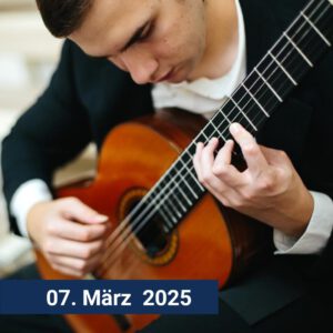 Foto von Belmin Okanović beim spielen seiner Gitarre.